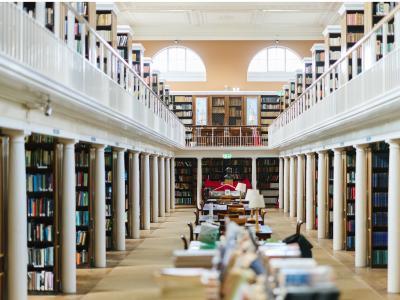 LMH's gallery style Library, which has shelves of books along each side and a wrap-around balcony