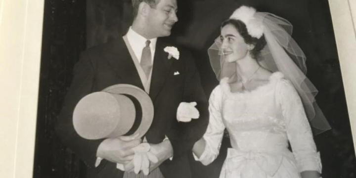 A black and white photo of a young couple getting married