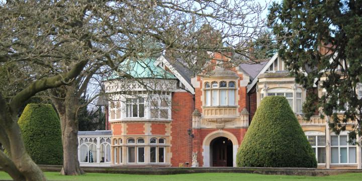 Bletchley Park, a red brick building surrounded by gardens