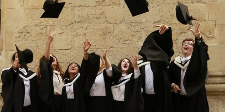 Graduates throwing their hats in the air