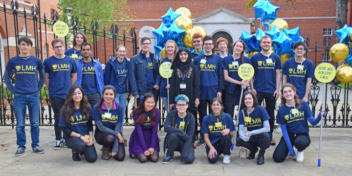 Photo of a group of student ambassadors wearing LMH t-shirts and holding balloons